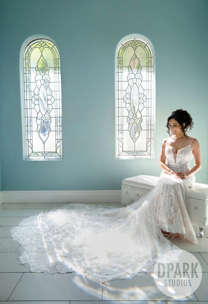 Intimate shot of bride holding bouquet against her gown