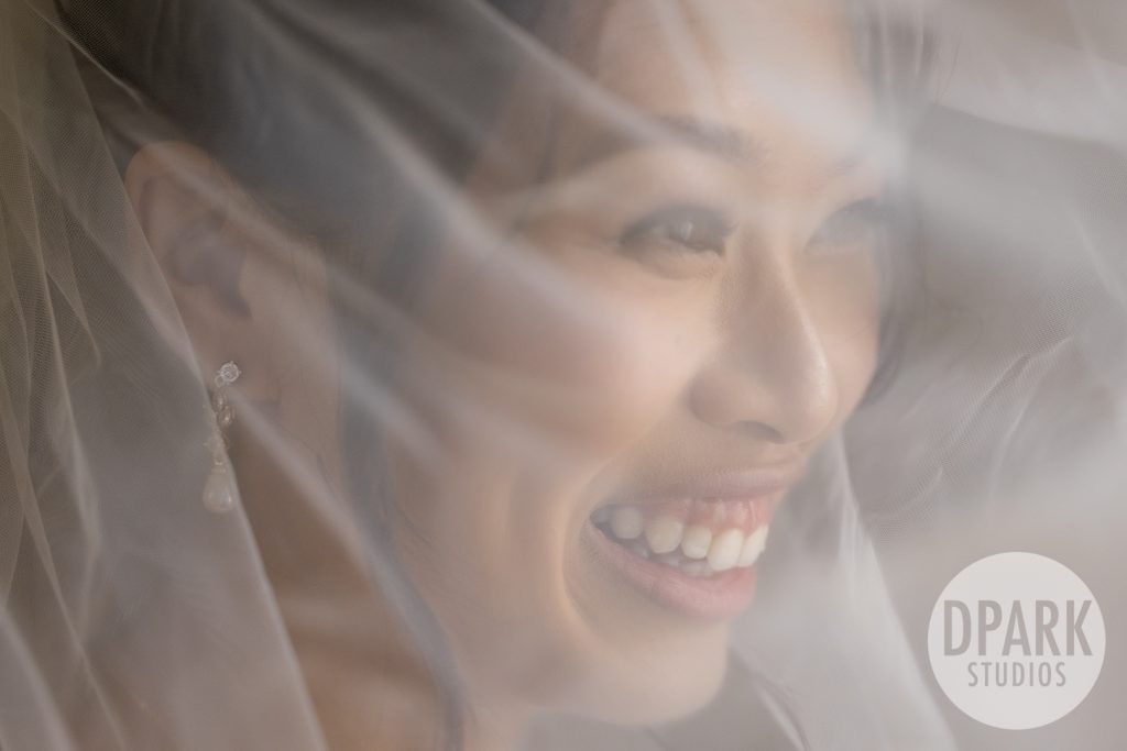 Bride’s Omega timepiece detail shot at destination sunflower wedding by D. Park Studios