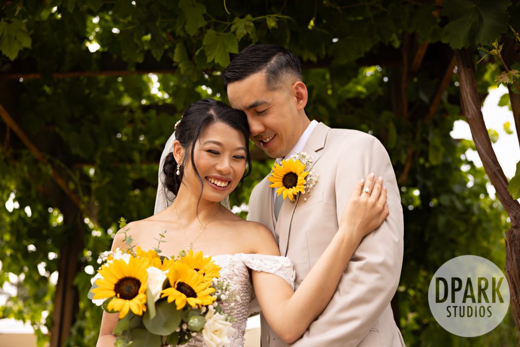 Bride’s Badgley Mischka shoes on sunflower-filled path at Aliso Viejo farm wedding