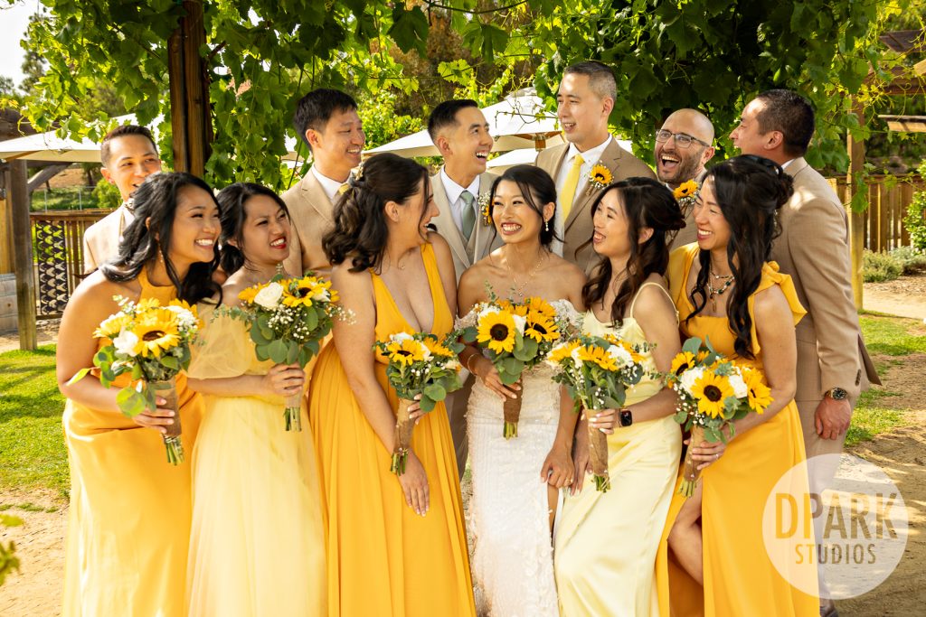 Sweetheart table surrounded by sunflowers at whimsical OC farm wedding by D. Park Studios