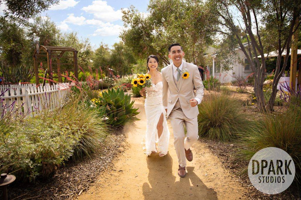 Whimsical sunflower aisle decor for outdoor wedding at Gold Coast Farms in Orange County