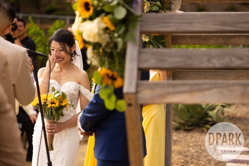 Badgley Mischka wedding shoes beside sunflower bouquet at whimsical Aliso Viejo wedding