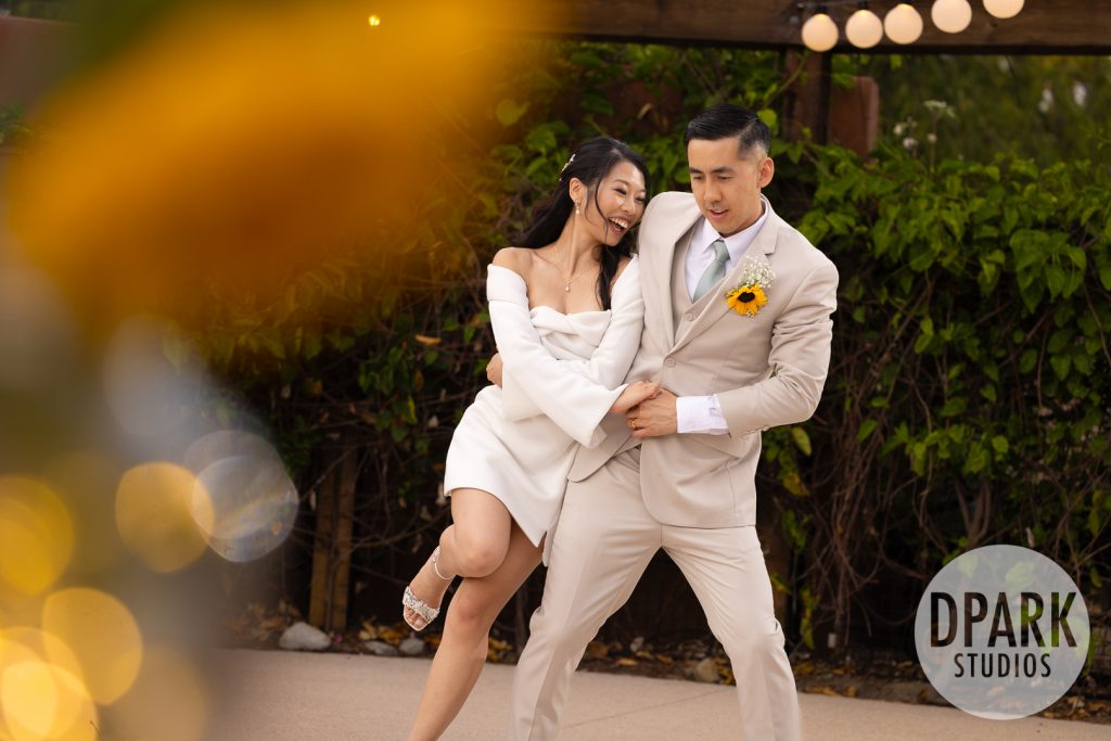 Couple laughing at toasts with guests at Gold Coast Farms wedding reception by D. Park Studios