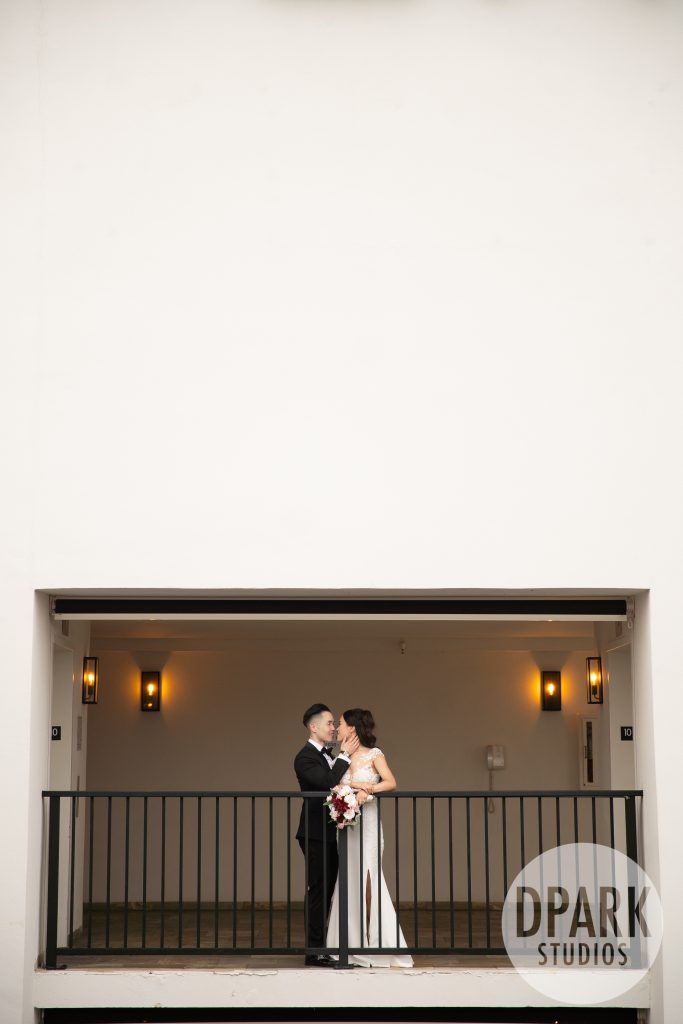 Romantic nighttime portraits under VEA Newport Beach lights