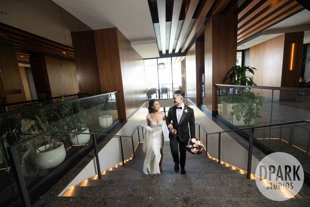 VEA Newport Beach ballroom wedding reception in elegant black and gold décor