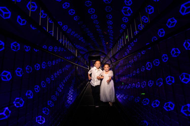 creative vortex tunnel siblings running museum photograph