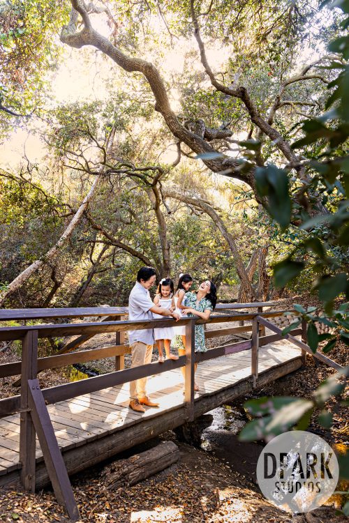 Le Family with two young daughters during a sunset family photography session at Oak Canyon Nature Center in Anaheim Hills 