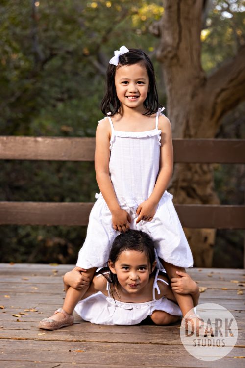 Funny big little sister pose when asked to pose whatever they want to do